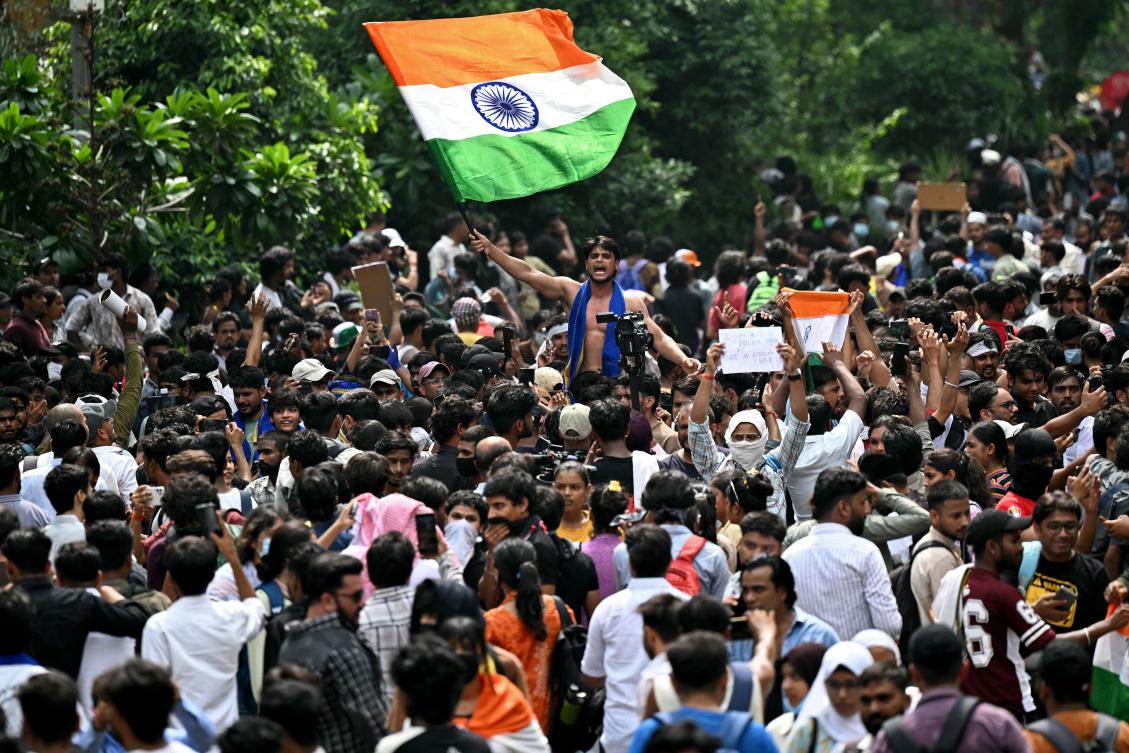 Cockroach Janta Party (CJP) supporters celebrate the resignation of India's Education Minister Dharmendra Pradhan, at Jantar Mantar in New Delhi on July 25, 2026 amid the ongoing protests over alleged NEET exam irregularities. (AFP)