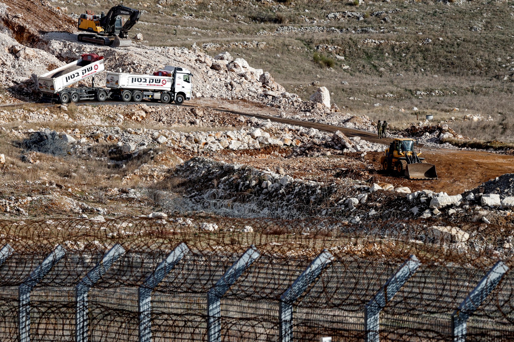 Israeli army bulldozers operate in the UN-patrolled buffer zone separates Israeli and Syrian forces in the Golan Heights on December 17, 2024. (AFP)