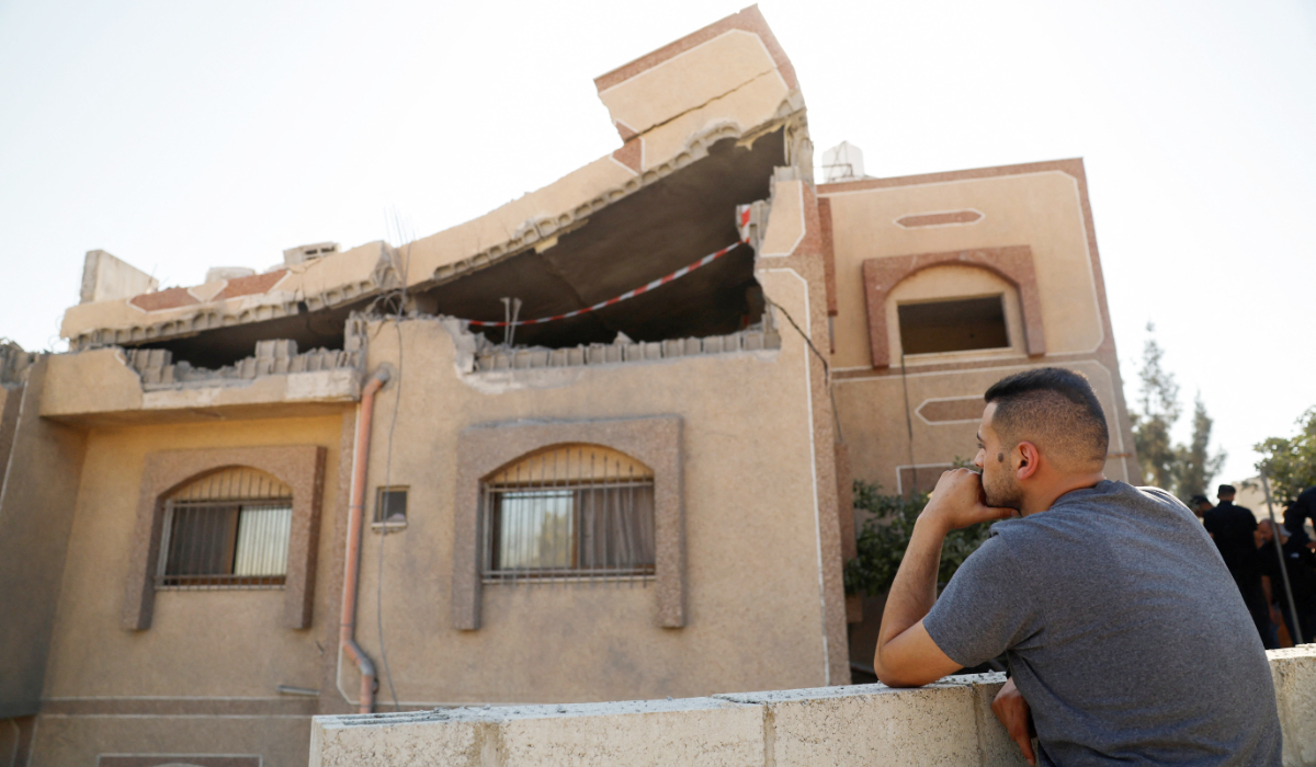 A man looks on, on the day Israeli forces blow up the house of Palestinian Farouk Ramadan, who was involved in a shooting during a settler attack on Tal village on July 24, in Tal, near Nablus, in the Israeli-occupied West Bank, August 11, 2026. (REUTERS)