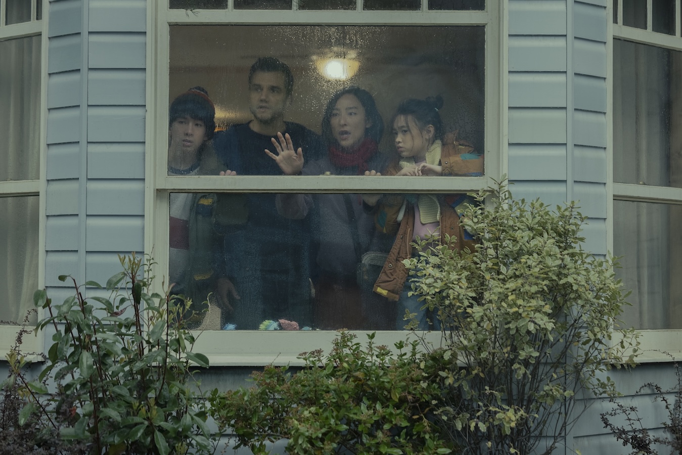 (L to R) Noah Sosnowski, Wagner Moura, Greta Lee,and Riley Chung in 'The Last House.' (Netflix)