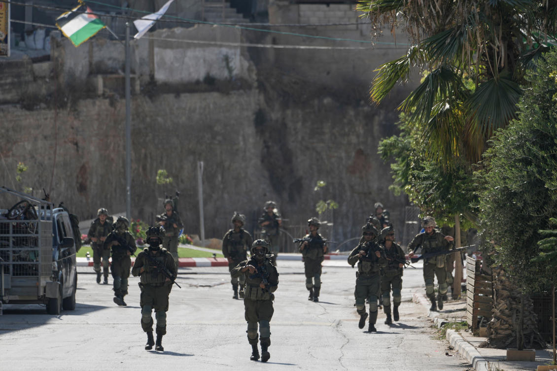 Israeli army soldiers patrol the streets of the occupied West Bank village of Qusra, south of Nablus, Thursday, Aug. 13, 2026. (AP)
