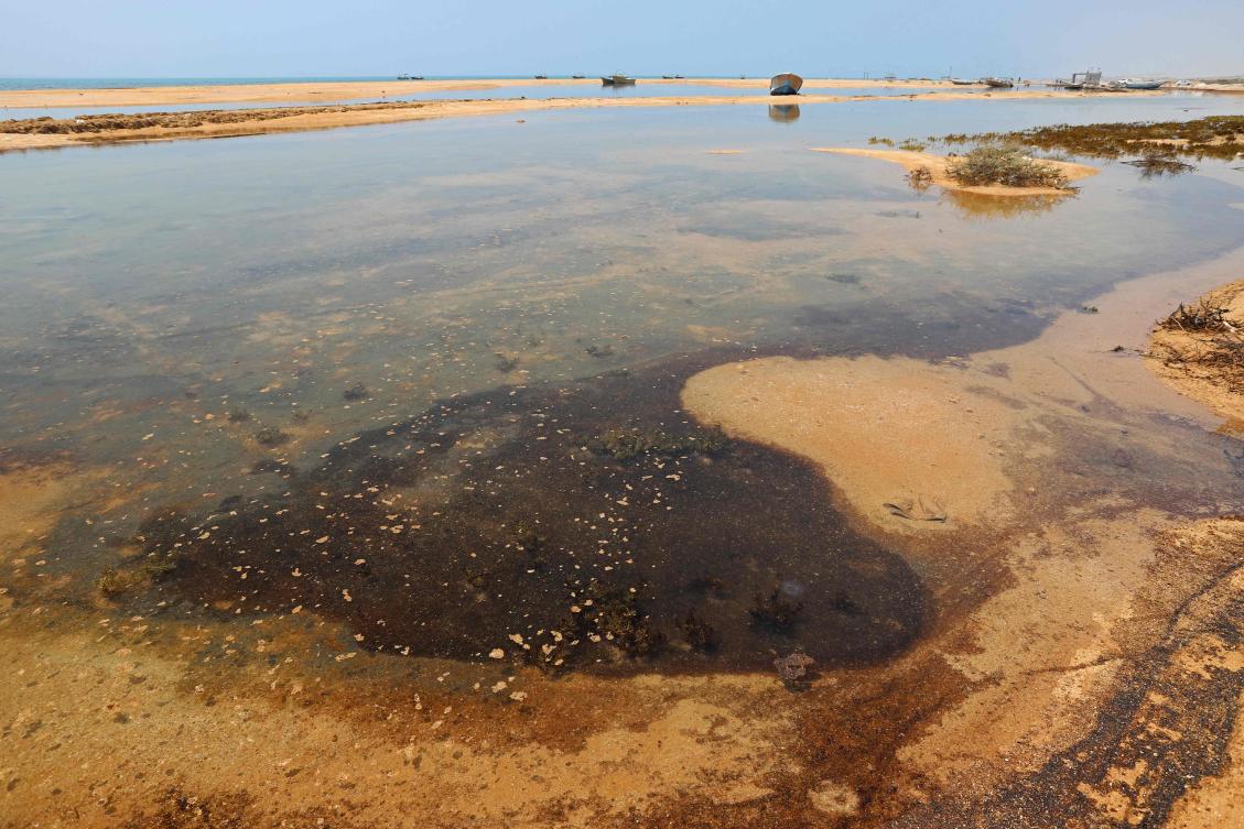 A British firm starts containment of oil spill from stricken tanker off Oman