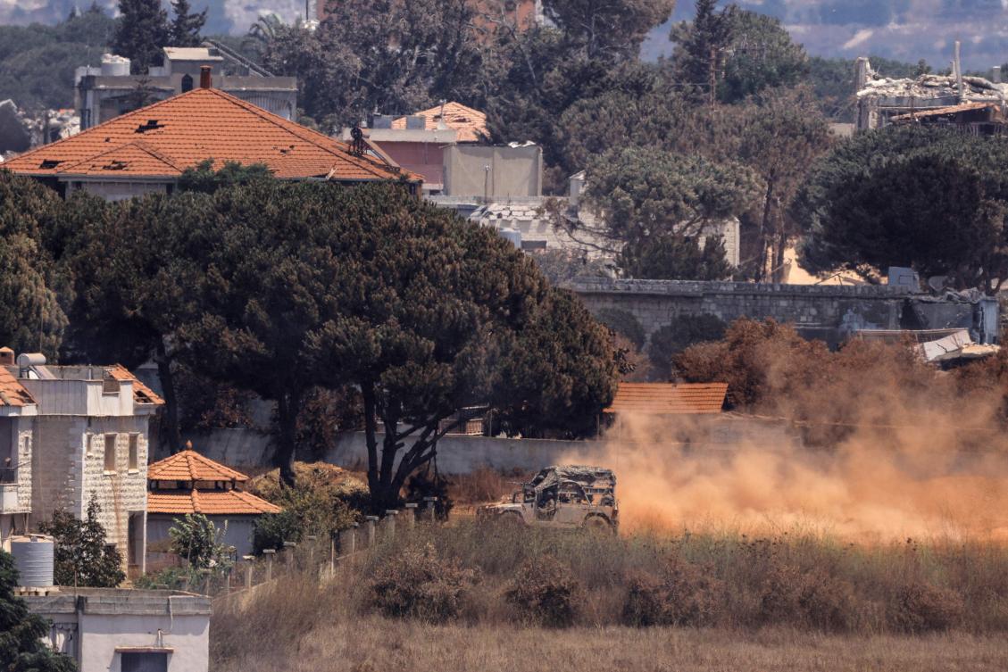 This picture taken from the southern Lebanese village of Zawtar al-Gharbiyah shows Israeli humvees driving through the nearby village of Zawtar al-Charkiyah on August 13, 2026. (AFP)