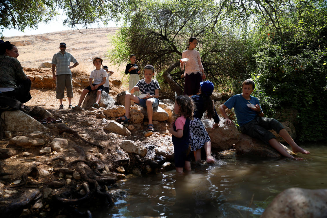 Israelis visit the Fasayil springs near the Palestinian village Fasayil, where residents say that Israeli settlers diverted water from the spring causing crops to die, in the Israeli-occupied West Bank on Aug.t 9, 2026. (Reuters)