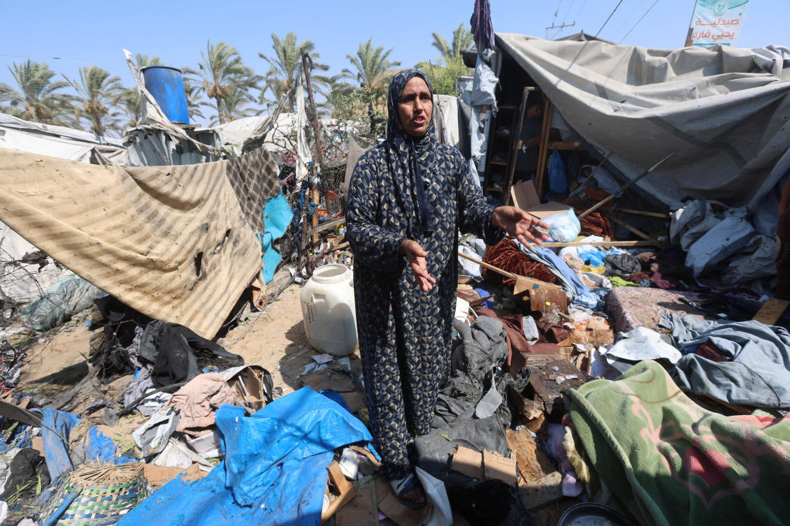 A Palestinian woman at the site of an Israeli strike on a tent, according to medics, in Khan Younis, in the southern Gaza Strip, on Sunday. (Reuters)