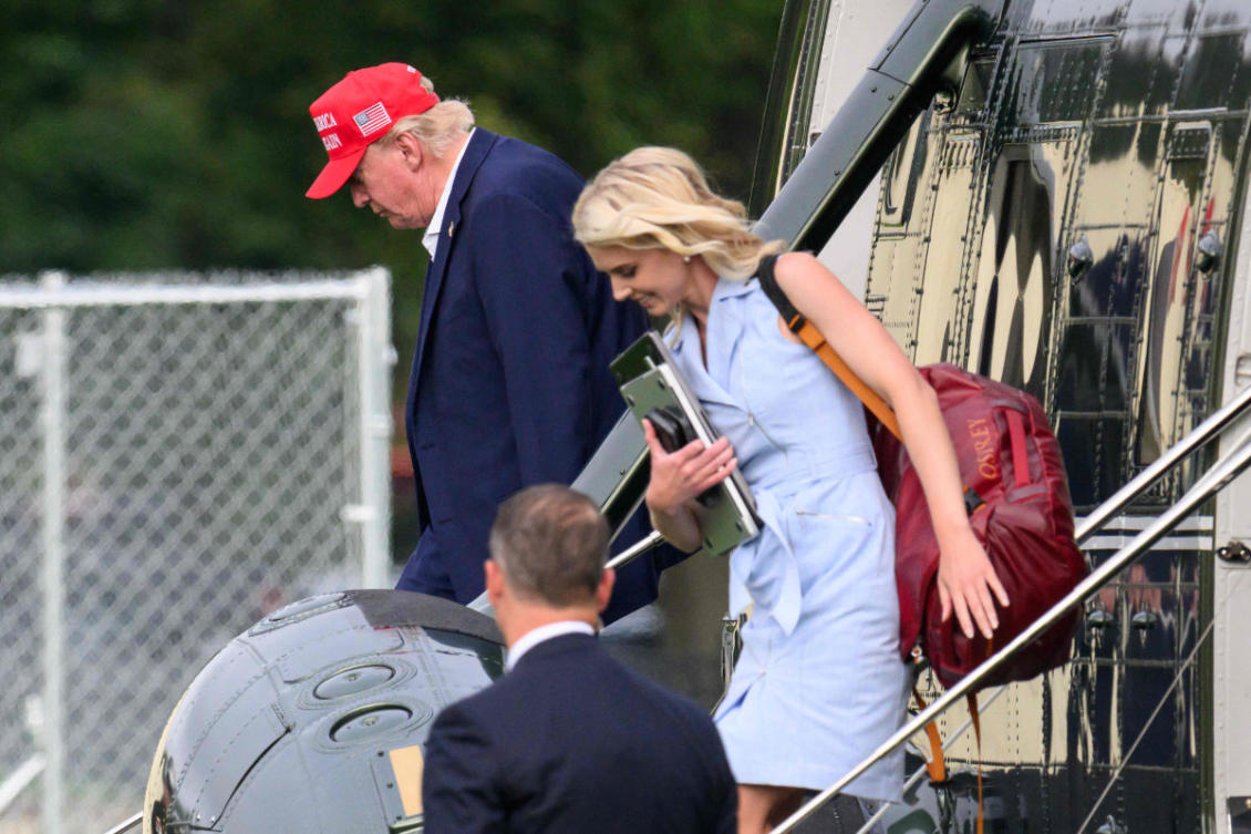 US President Donald Trump and aide Natalie Harp (R) exit Marine One on the Ellipse near the White House on August 16, 2026. President Trump is returning to Washington, DC, after spending the weekend at his golf club in New Jersey. (AFP)