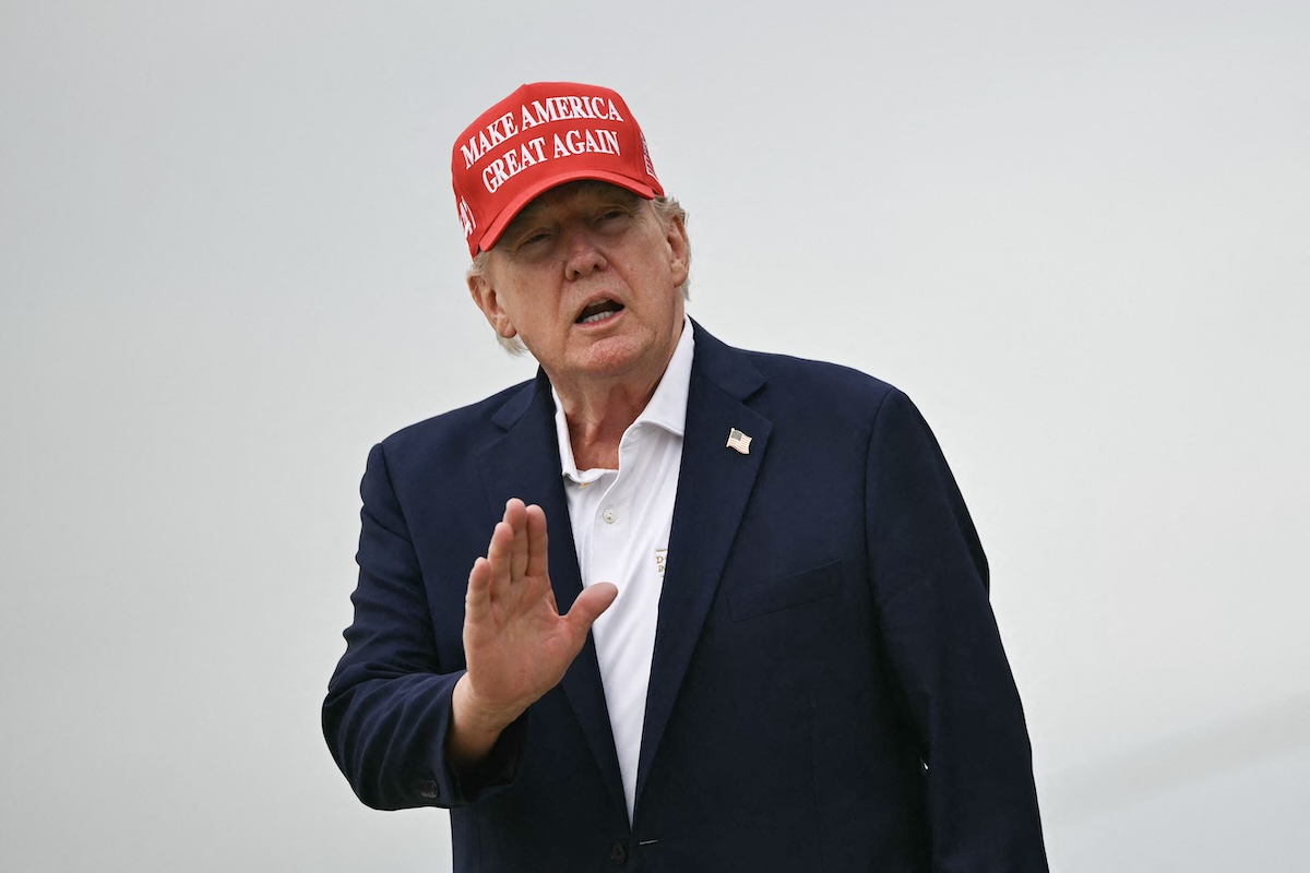 US President Donald Trump gestures as he steps off Air Force One upon arrival at Joint Base Andrews in Maryland on August 16, 2026. (FILE/AFP)