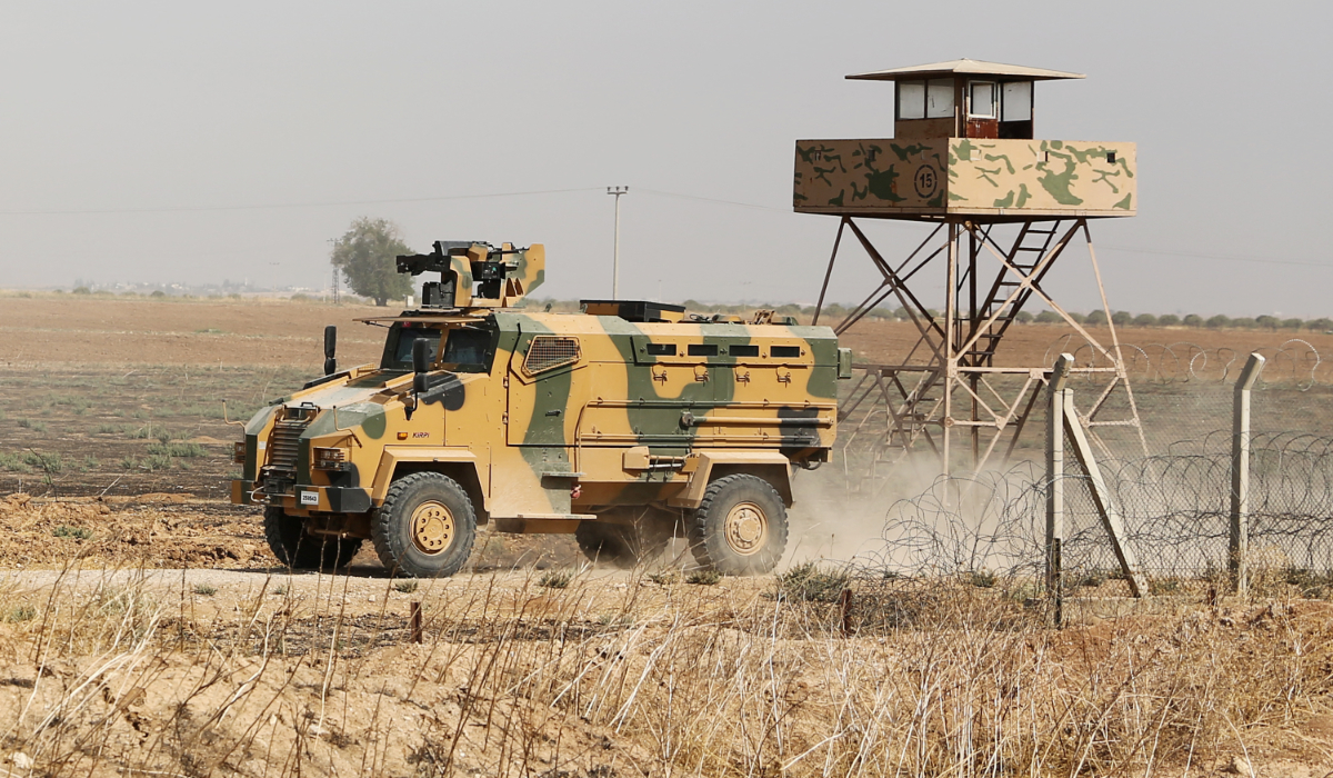 A Turkish armoured vehicle driving along the Turkish side of the border during the ongoing offensive against Kurdish-controlled areas in northeastern Syria launched by the Turkish military. (AFP)