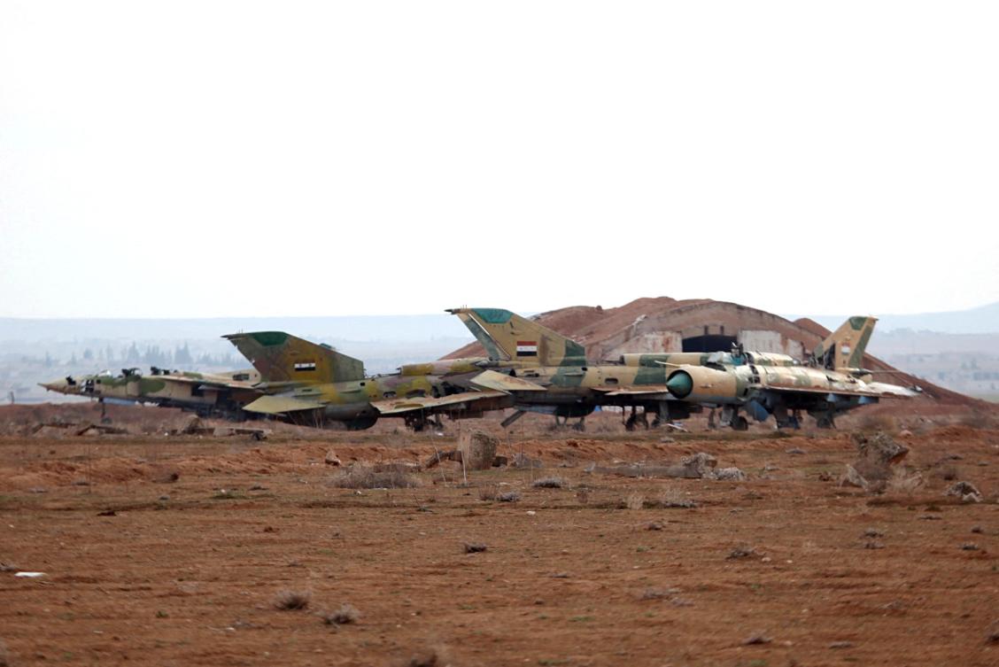 A picture taken on January 21, 2018 shows damaged Syrian air force fighter planes at the Abu Duhur military airport area in Syria's Idlib province. (File/AFP)