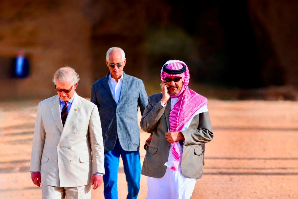 King Charles III, then Prince of Wales, accompanied by Prince Sultan bin Salman bin Abdulaziz, with the late photographer Humberto Martins da Silveira between them, during their visit to historical and archaeological sites in AlUla, Saudi Arabia, in February 2015. (Supplied)