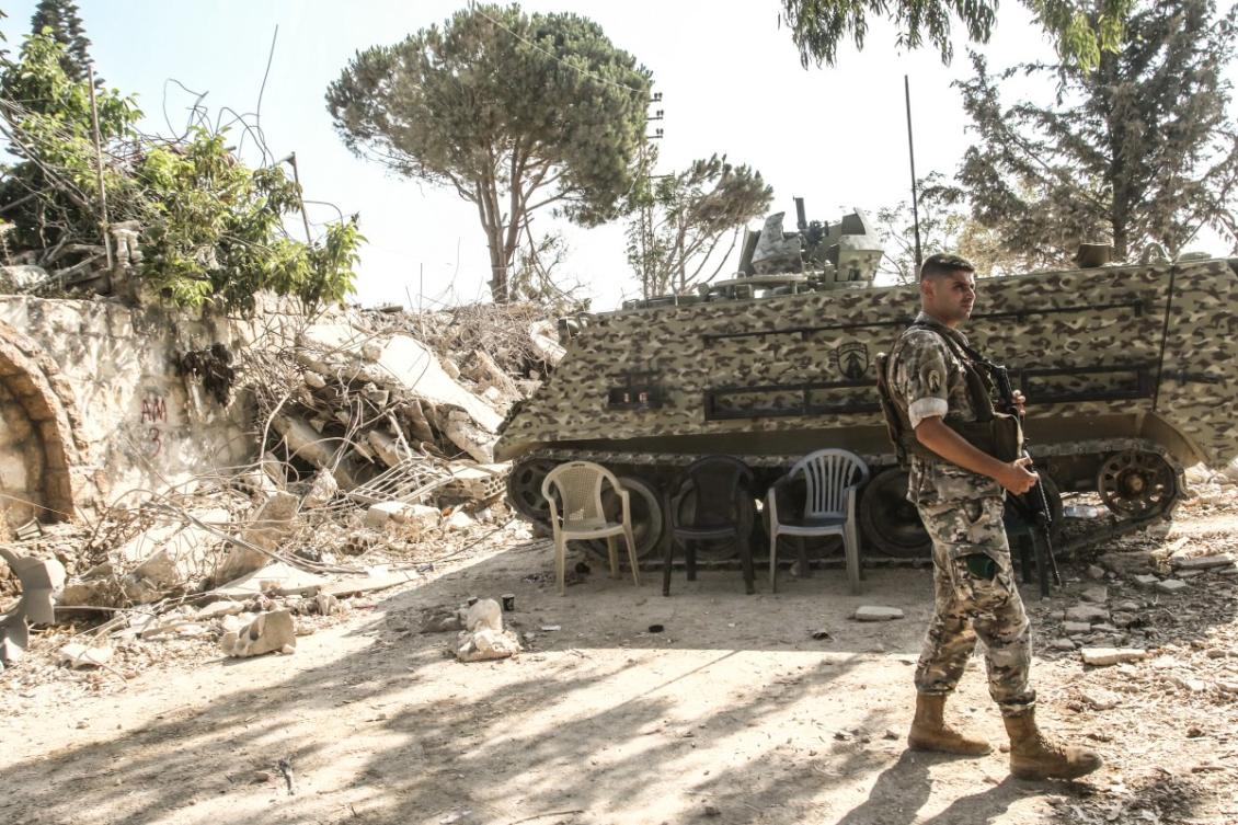 Above, a Lebanese army soldier stands on guard by his armored vehicle in the southern Lebanese village of Zawtar Al-Gharbiyah on Aug. 8, 2026. (AFP)