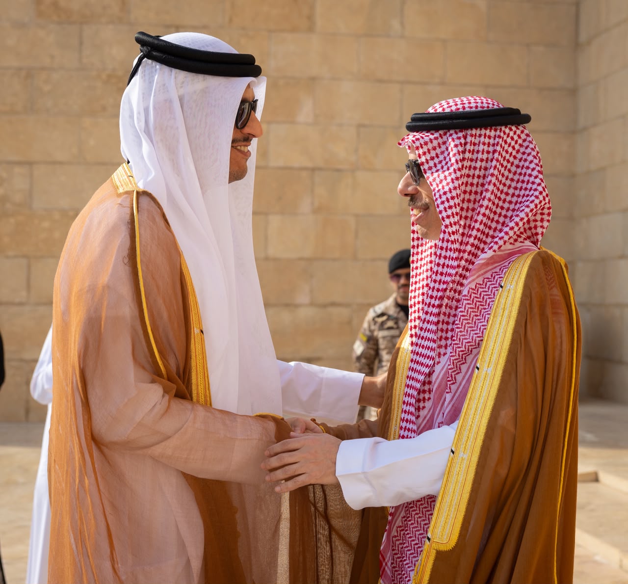 Prince Faisal bin Farhan and Sheikh Mohammed bin Abdulrahman bin Jassim Al-Thani shake hands in Riyadh. (SPA)
