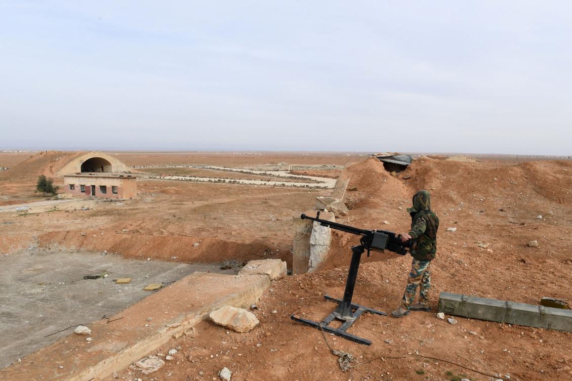 Above ,a member of Syrian government forces stands guard the Abu Al-Duhur military air base area in Idlib province in 2018. (AFP file photo)