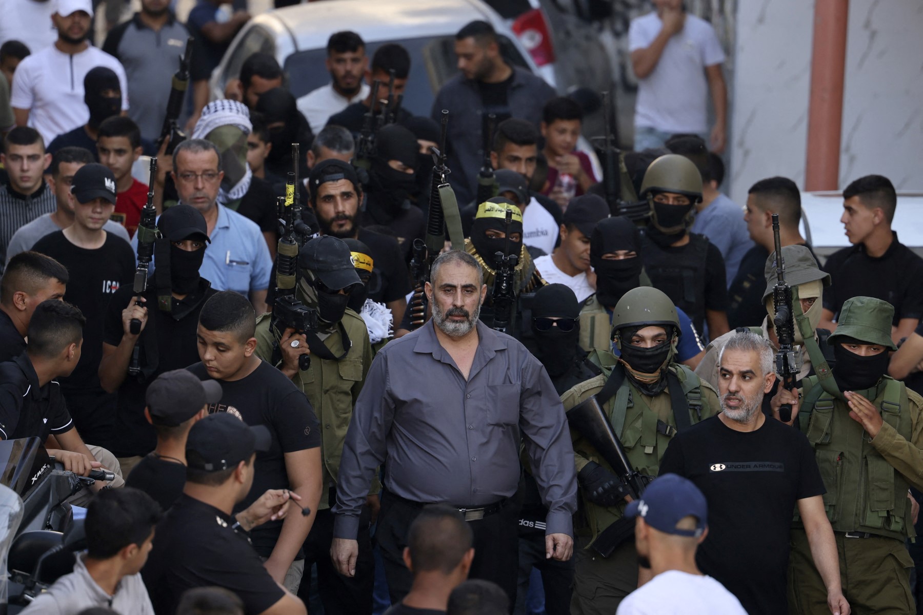 Above, Fathi Zidan Hazem attends the funeral of his son near the West Bank city of Jenin on Sept. 28, 2022. Hazem was shot dead by Israeli forces early Friday, Aug. 21, 2026. (AFP file photo)