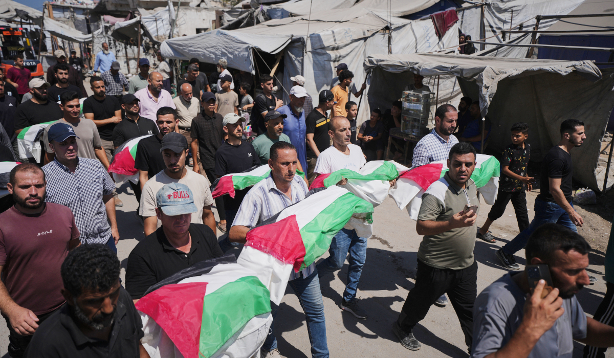 Mourners carry the flag-draped bodies of Palestinians, killed in Israeli strikes during the war with Hamas, whose remains were recently recovered from the rubble in Gaza City, Thursday, Aug. 20, 2026. (AP)