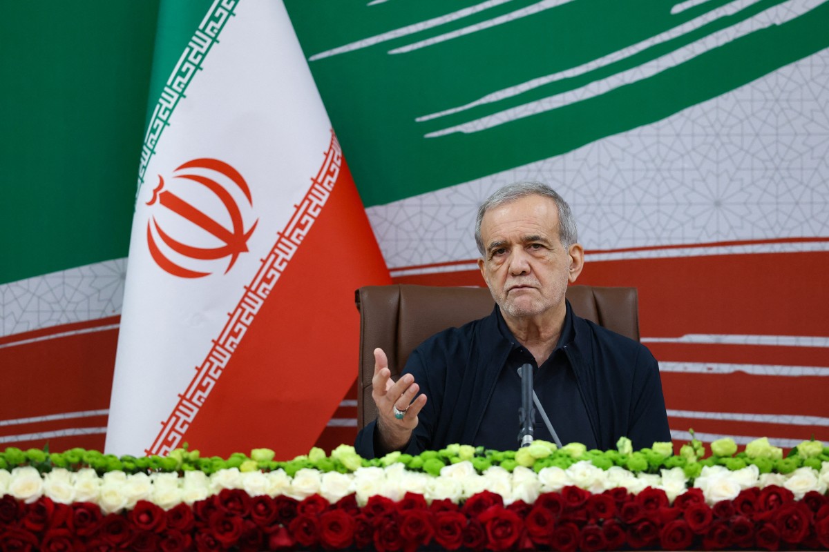 A handout photo made available by the Iranian Presidential Office shows Iran's President Masoud Pezeshkian gesturing as he speaks during a press conference in Tehran, Iran, (AFP)