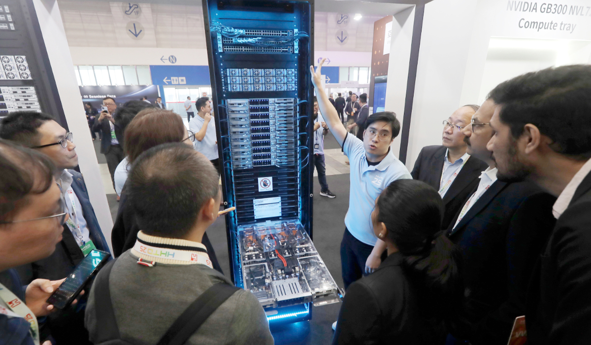 Visitors listen to the introduction of NVIDIA GB300 NVL72 AI server during the Hon Hai Tech Day (HHTD 25) at the Nangang Exhibition Center in Taipei, Taiwan, Nov. 21, 2025. (AP)