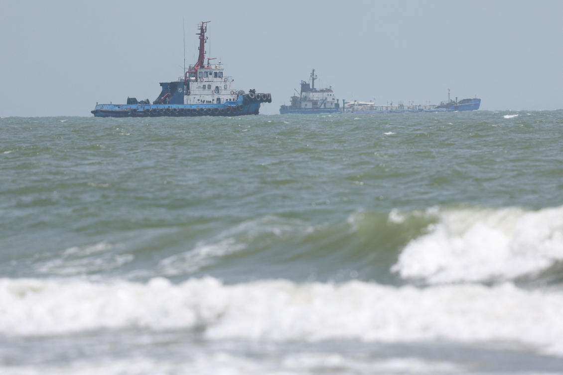 Vessels in the Strait of Hormuz are visible near the beach of Bandar Abbas, Iran, August 25, 2026. (Reuters)