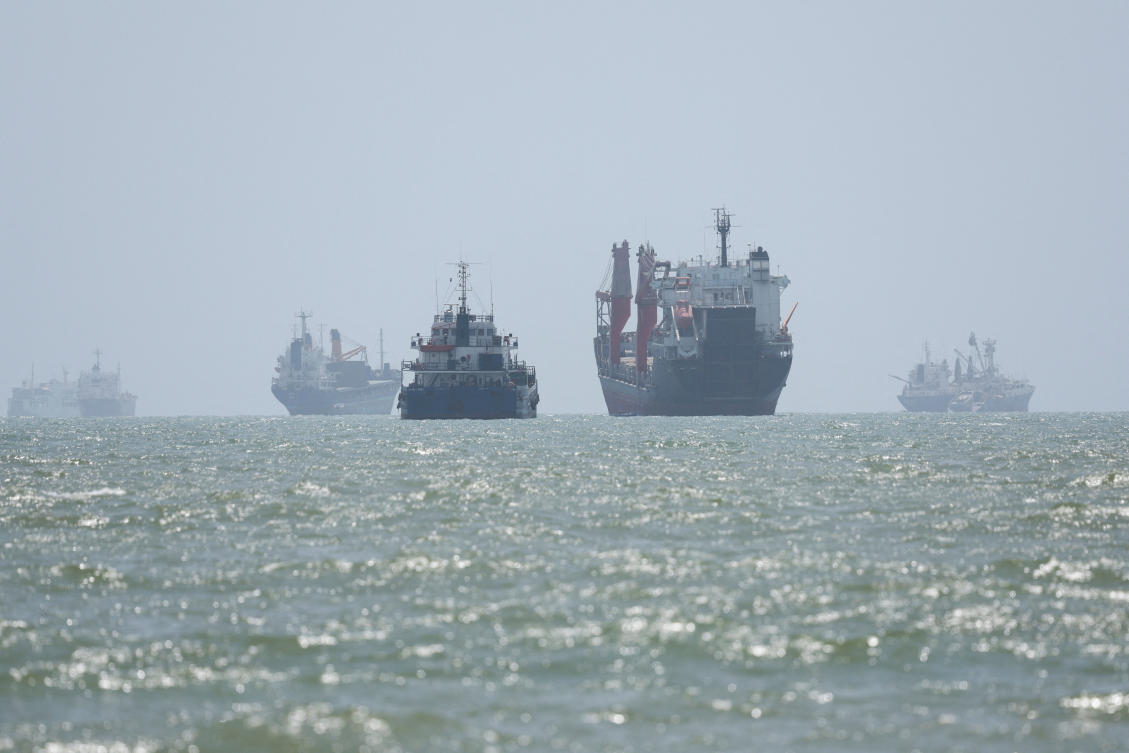 Above, maritime traffic in the Strait of Hormuz are visible near the beach of Bandar Abbas, Iran on Aug. 25, 2026. (WANA via Reuters)
