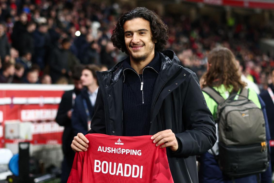 (FILES) Lille's French midfielder #32 Ayyoub Bouaddi poses for a photograph with a jersey reading "Bouaddi 2029" after his contract's extension with Lille ahead of the French L1 football match between Lille LOSC and Olympique de Marseille (OM) at the Pierre-Mauroy stadium in Villeneuve-d'Ascq, northern France, on December 5, 2025. (AFP)