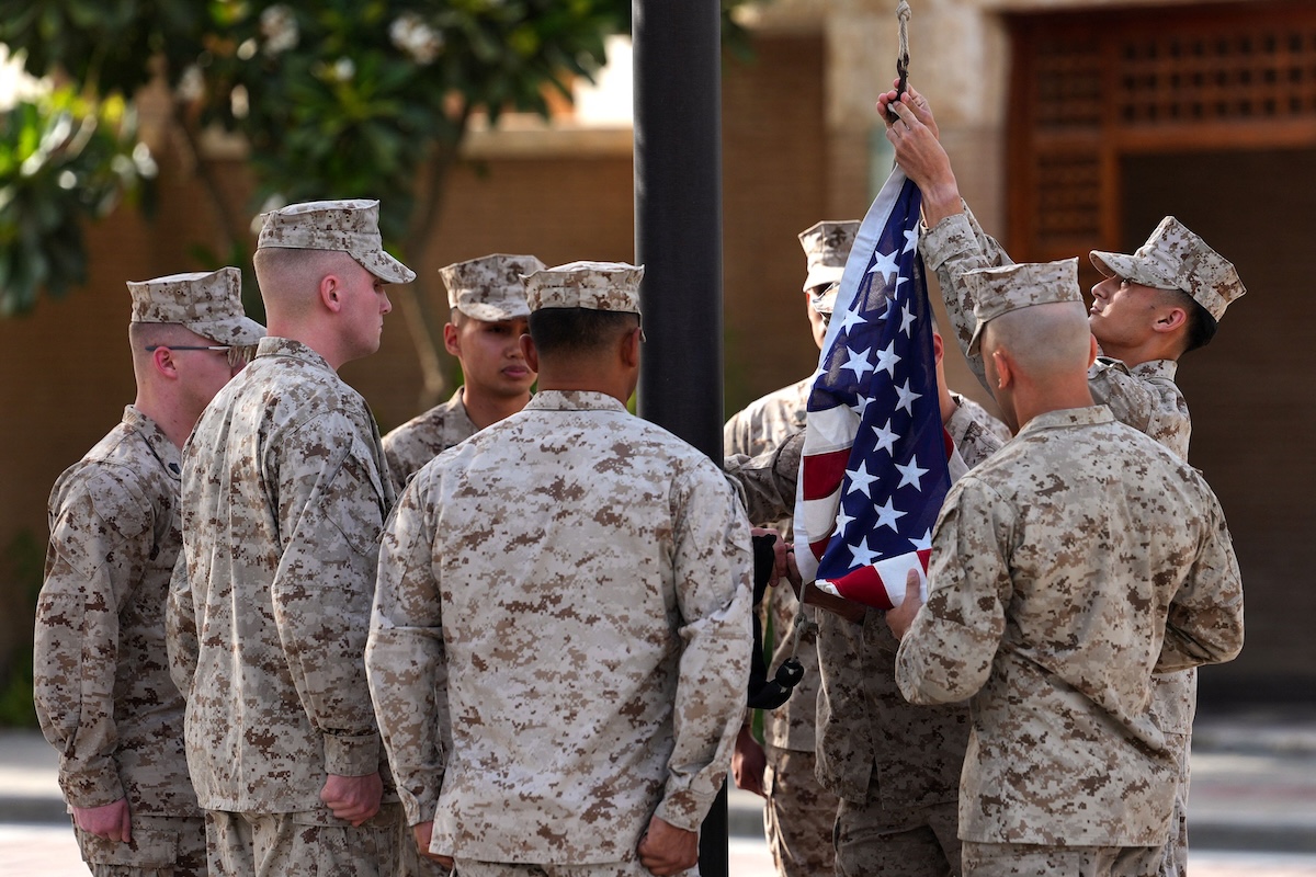 Above US Marines raise the flag at the US Embassy in Kuwait on June 24, 2026. (AFP file photo)