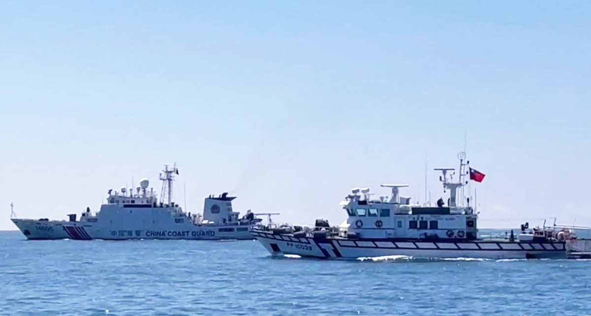 A handout photo from the Taiwan Coast Guard shows a Taiwan Coast Guard patrol vessel sailing near a China Coast Guard ship in waters south of Kinmen.