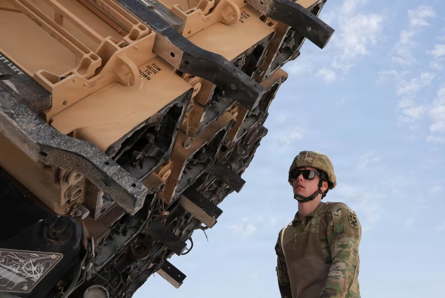 A US Army air defense artilleryman inspects spent Patriot interceptors in the Middle East. (US Army)