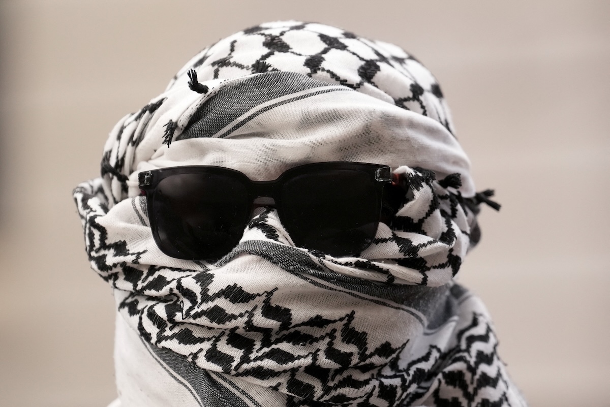 Above, a pro-Palestine activist in Britain, which previously banned Palestine Action as a terrorist organization. (Reuters file photo)