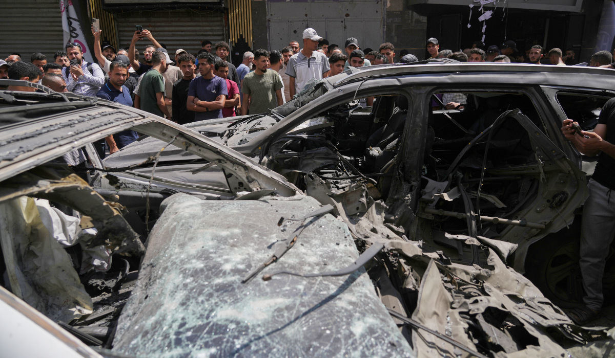 Palestinians inspect damaged vehicles following an Israeli airstrike in Gaza City, Monday June 22, 2026. (AP)