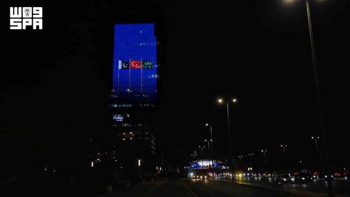 Saudi landmarks glow with three flags