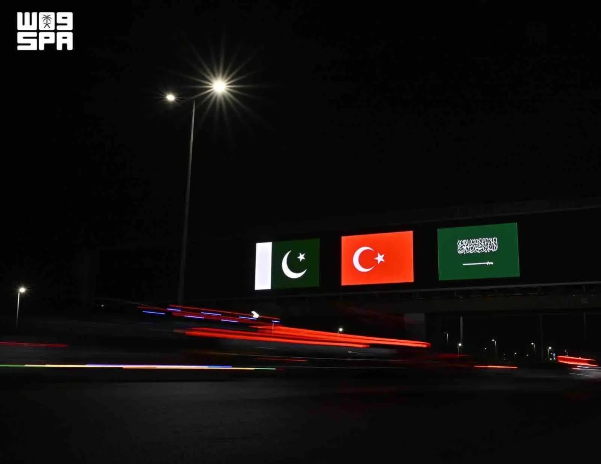 Saudi landmarks glow with three flags