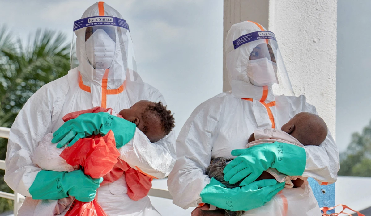 Medical workers carry children tested and cleared off from Ebola from Saint Nicholas orphanage in Bunia town, Ituri province, Democratic Republic of Congo. (Reuters file photo)