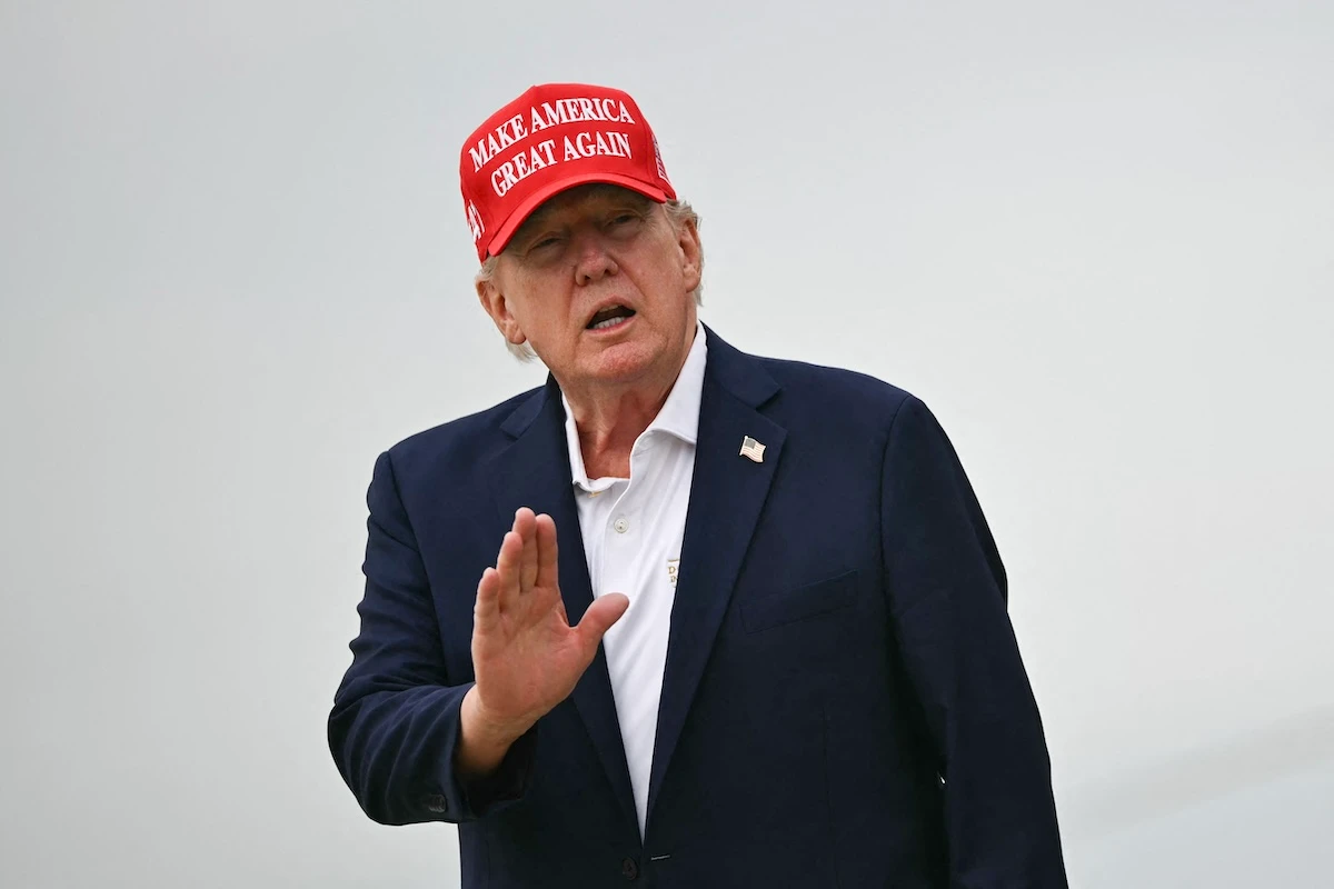 US President Donald Trump gestures as he steps off Air Force One upon arrival at Joint Base Andrews in Maryland on August 16, 2026. (FILE/AFP)
