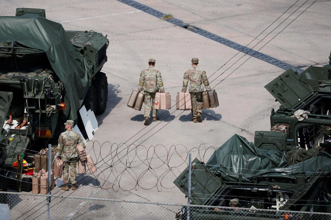 Above, US Army soldiers move jerrycans at a US army base near the demilitarized zone separating two Koreas, in Dongducheon, South Korea on Aug. 18, 2026. (Reuters)