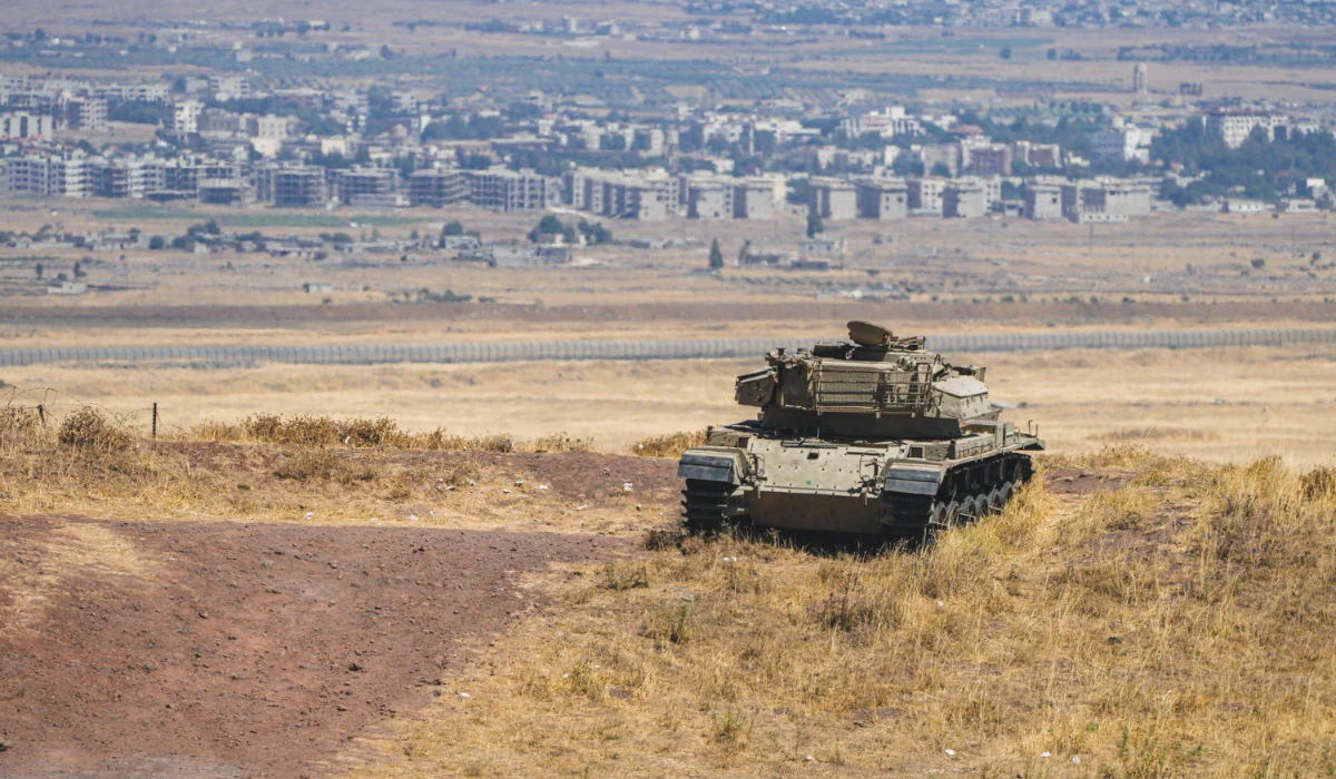 An Israeli tank is positioned near the ceasefire line between the occupied Golan Heights and Syria on Aug. 20. (Reuters)