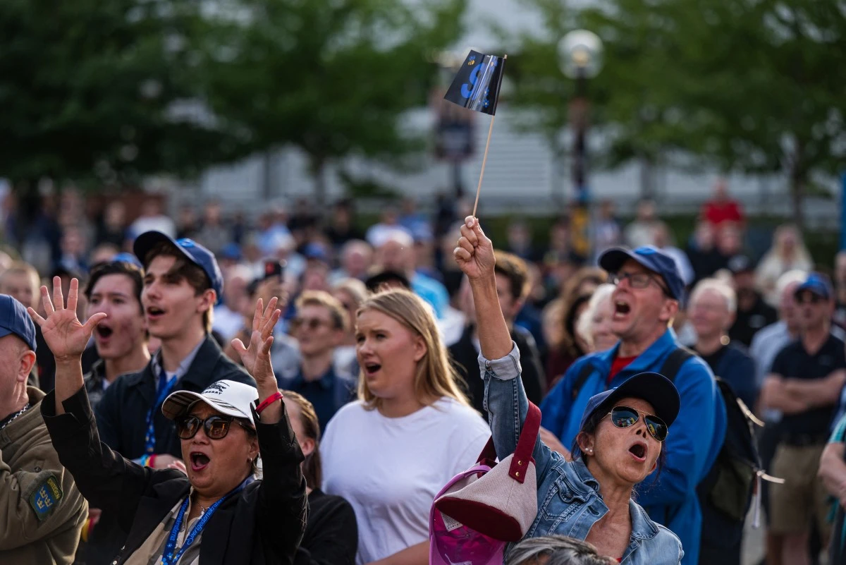 Supporters of Sweden Democrats party leader Jimmie Akesson listens to him addressing an election campaign event at Sjodalsparken in Huddinge, Sweden. (AFP)