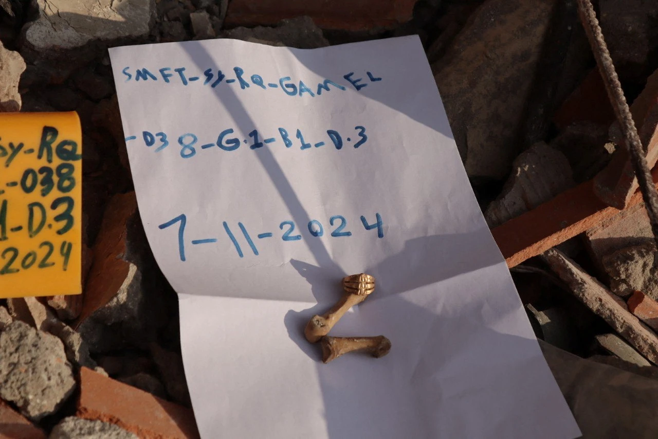 A ring is seen on a finger bone at the collapsed Jakkak Building in Raqqa, Syria. (File/Reuters)