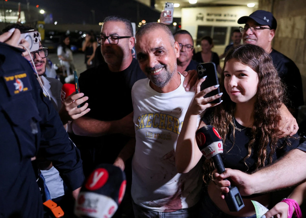 Yaniv Hayun, one of the men who helped incapacitate the attacker on the FlyDubai aircraft bound for Israel from the UAE, reacts after arriving at the Ben Gurion International Airport in Lod, Israel, on September 30, 2026. (REUTERS)