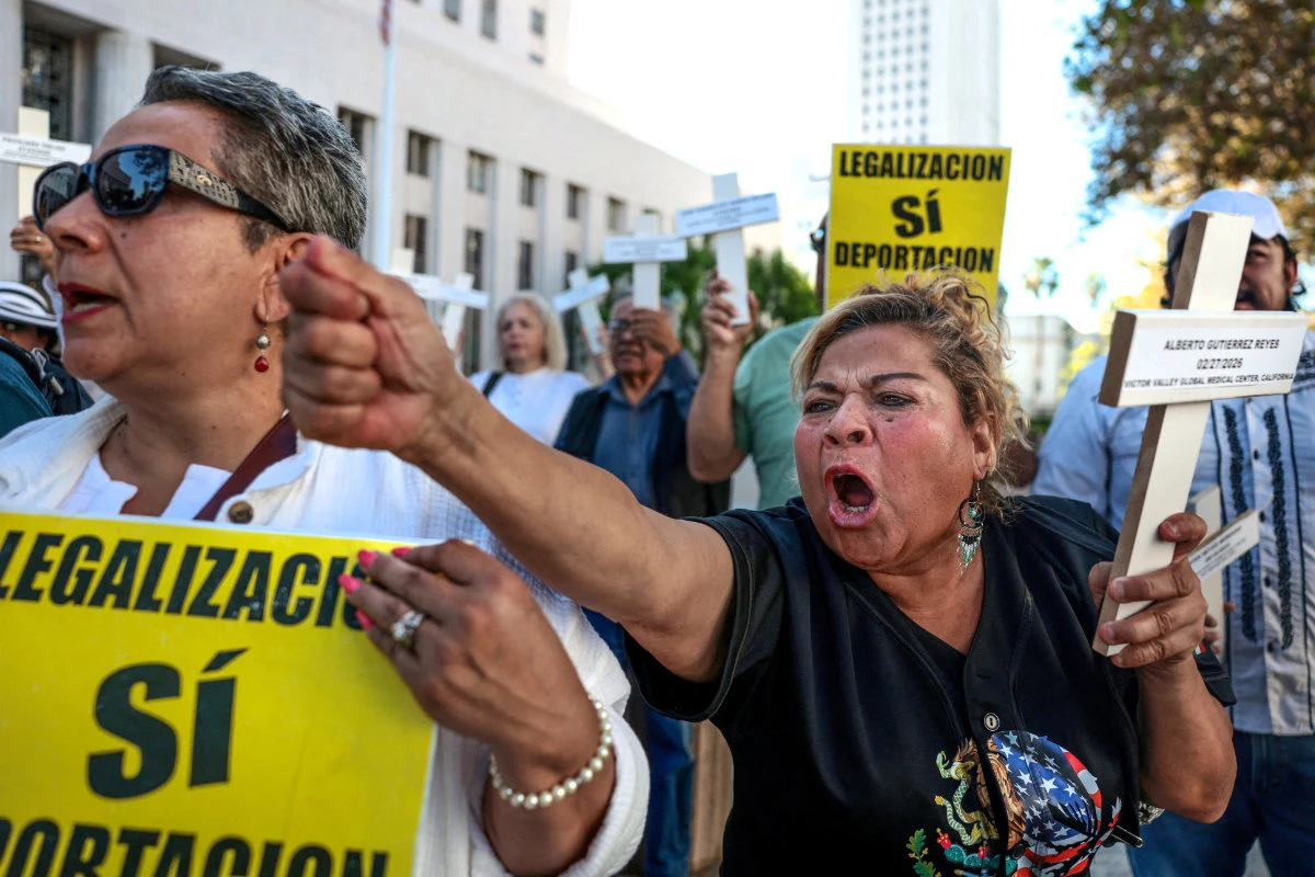 A woman demonstrates outside the US Federal Courthouse in Los Angeles, California, on October 16, 2026, calling for an end to immigration enforcement raids. (REUTERS)