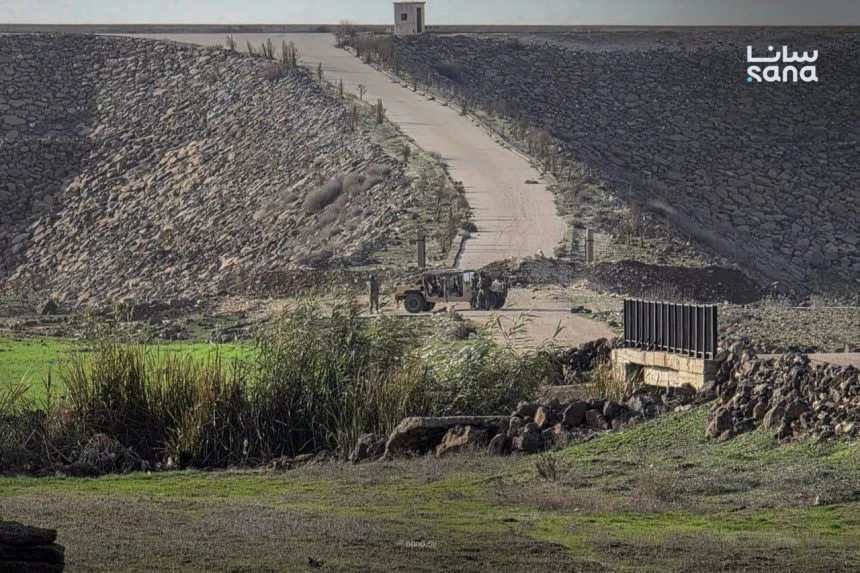 Israeli military vehicles stationed along a road in Daraa countryside during an incursion. (SANA/ File photo)