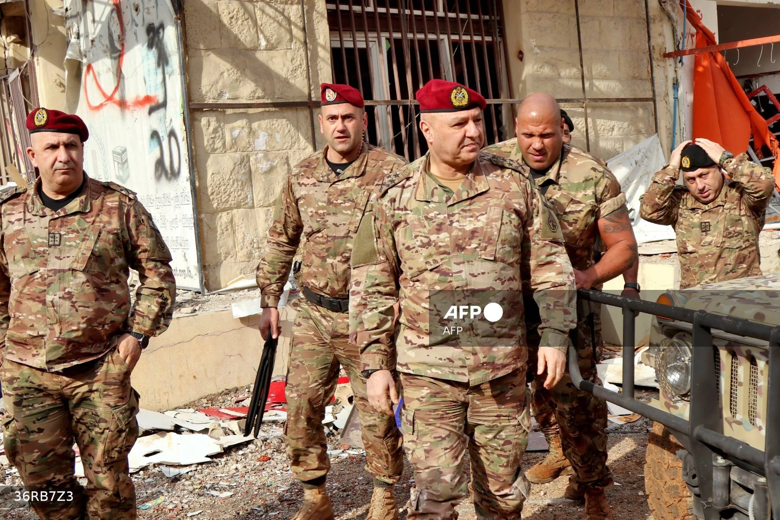 Lebanese army commander, General Joseph Aoun (C), visits the southern Lebanese village of Khiam on December 23, 2024, after the withdrawal of Israeli forces from the area under a ceasefire deal with Hezbollah. Israel stepped up its campaign in south Lebanon in late September after nearly a year of cross-border exchanges begun by Hezbollah in support of Hamas following its Palestinian ally's October 7, 2023 attack on southern Israel. A ceasefire came into effect on November 27. (Photo by AFP)