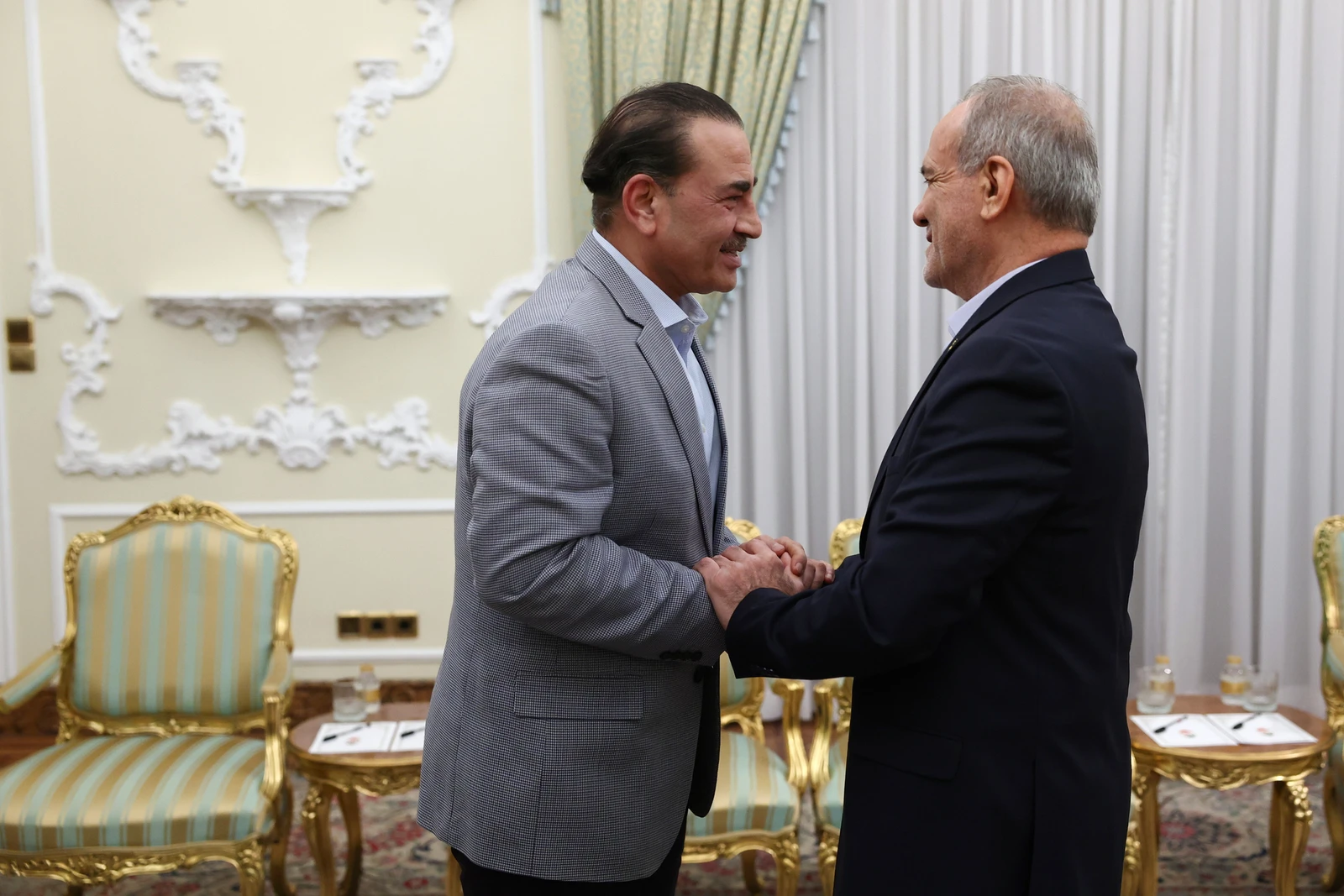 President Masoud Pezeshkian, right, greets Pakistan's Army Chief Field Marshal Gen. Asim Munir at the start of their meeting in Tehran, Oct. 20, 2026. (Iranian Presidency Office via AP)