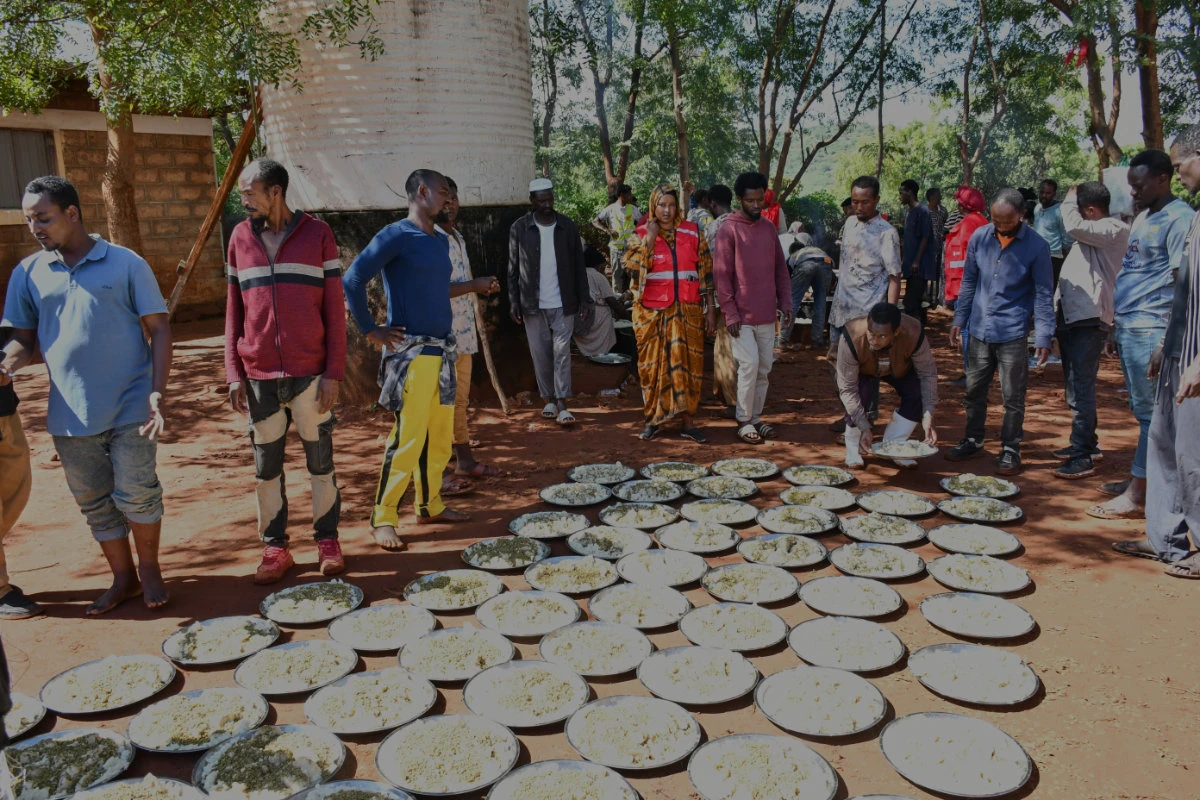 Ethiopians, fleeing regional fighting, receive food from the Kenya Red Cross after crossing into Kenya in Moyale, Marsabit County, Kenya, on Oct. 27, 2026. (AP Photo)