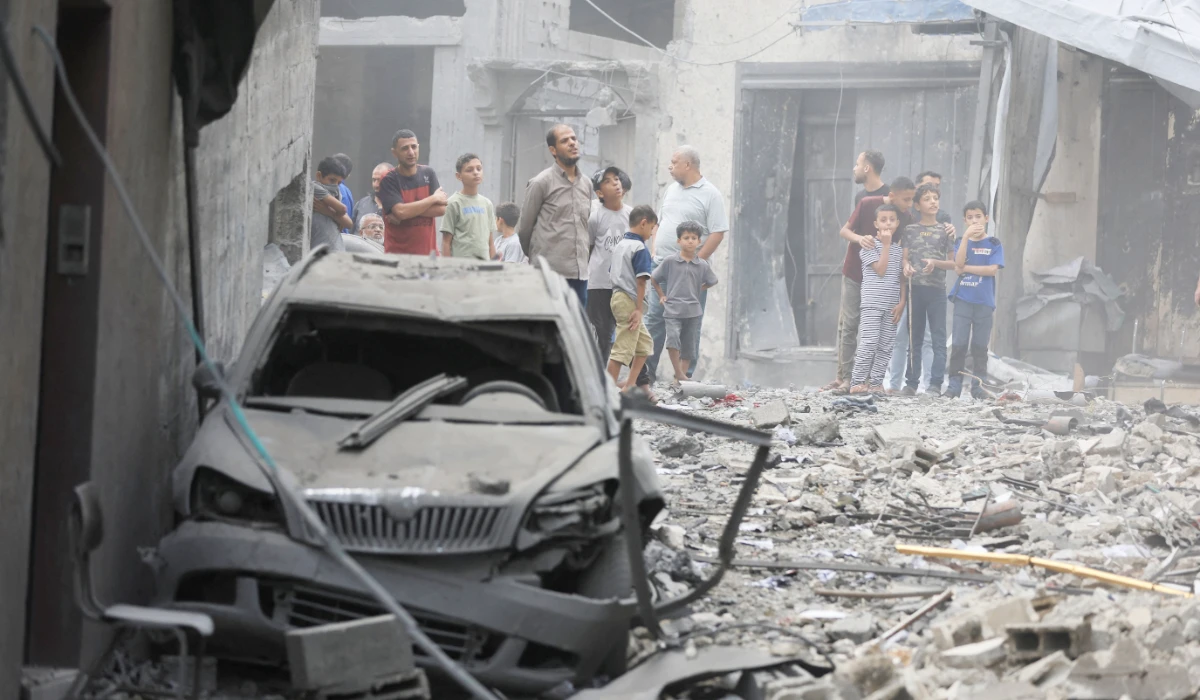 Palestinians inspect the site of a house targeted by Israeli airstrikes after the Israeli military warned residents to evacuate late on Thursday evening, in Gaza City, October 9, 2026. (REUTERS)