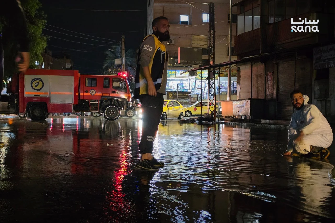 Syrian Civil Defense teams use a water-pumping truck to drain floodwater from a street following heavy rainfall in Syria, Oct. 28. (SANA)