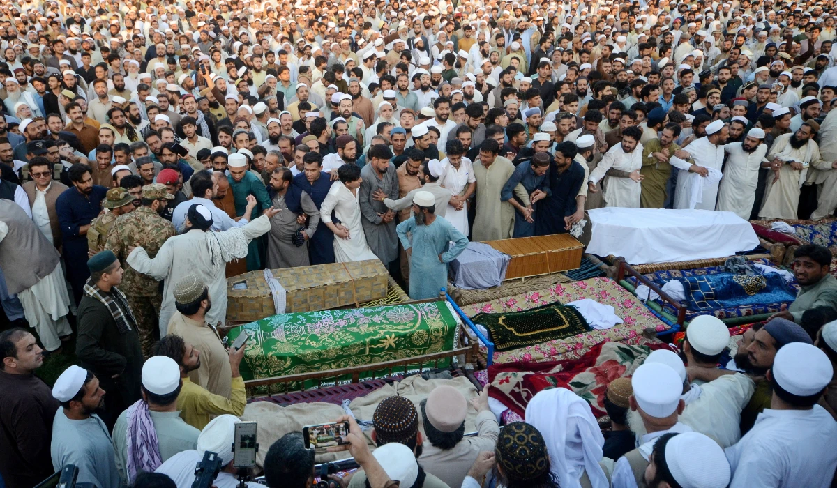 People gather around the coffins of victims who died in a school roof collapse, during a funeral in Peshawar, Pakistan, October 15, 2026. (REUTERS)