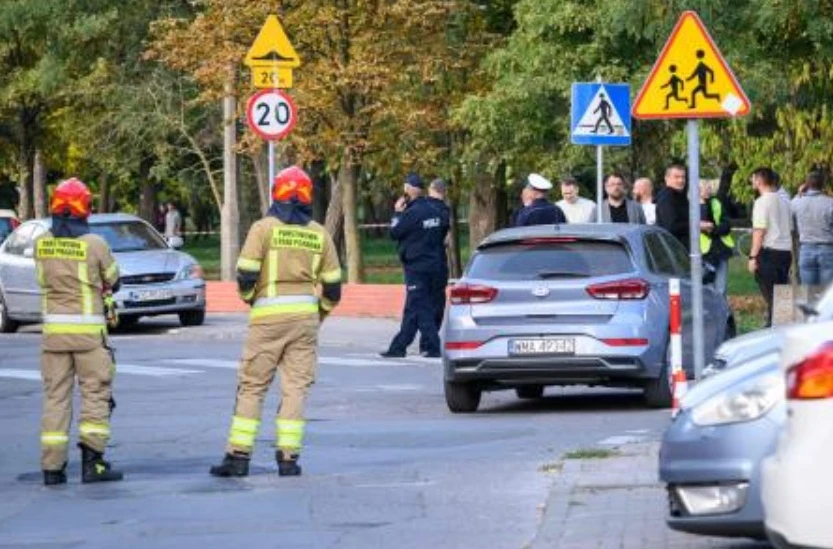 Forensic investigators work at the scene of a knife attack at a vocational school in the town of Ostroleka, some 120 km north of Warsaw on Oct. 7, 2026. (AFP)
