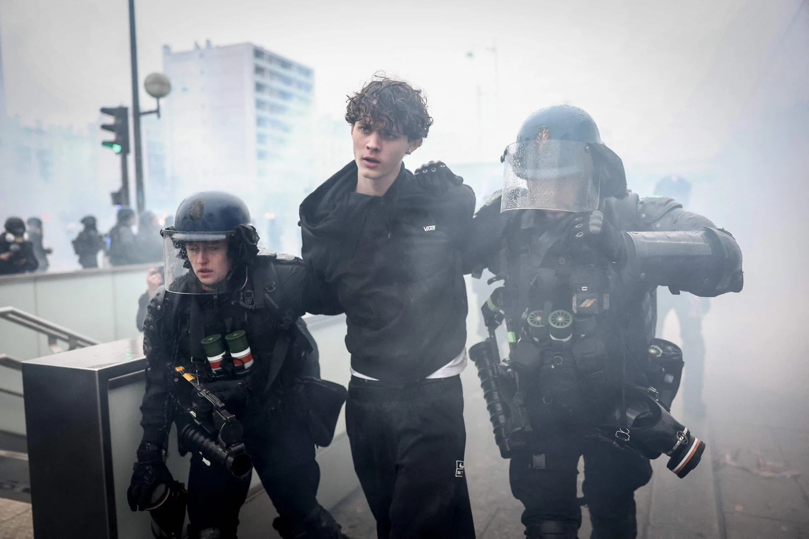 French Gendarmes detain a protester during a demonstration in Paris on Saturday. (AFP)