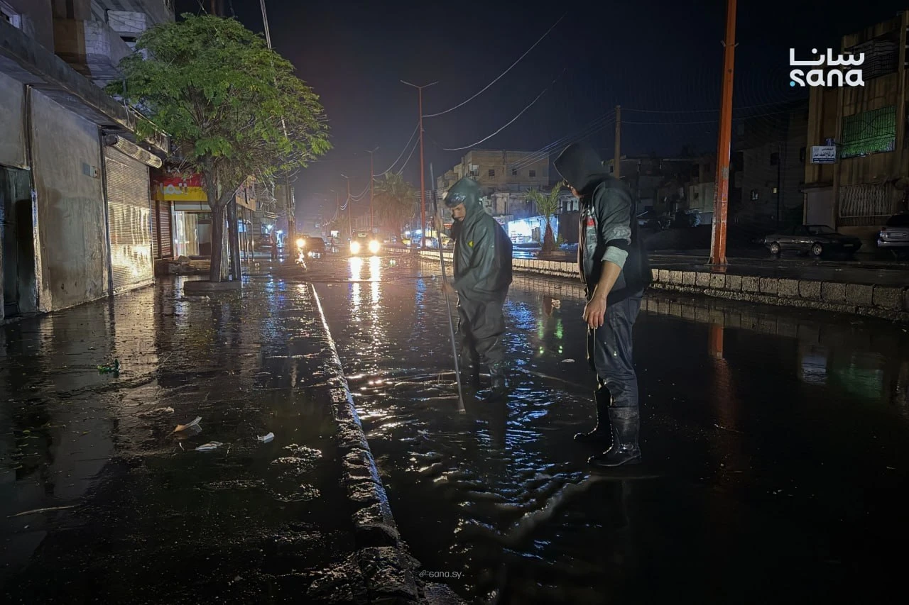 Syrian Civil Defense teams use a water-pumping truck to drain floodwater from a street following heavy rainfall in Syria, Oct. 28. (SANA)