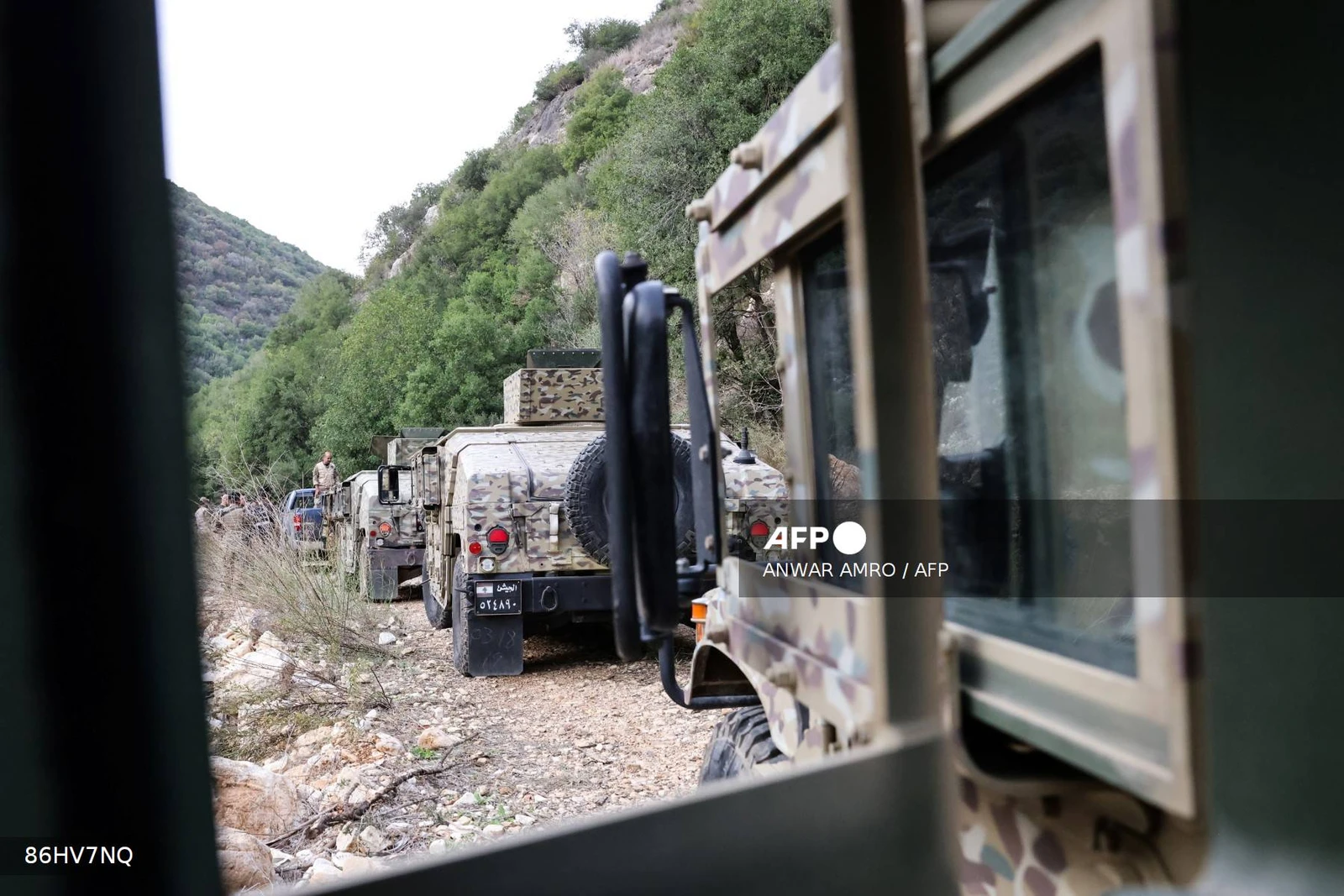 This photograph taken during a press tour organised by the Lebanese army shows a military convoy heading to an abandoned tunnel (unseen) said to have been used by Hezbollah, in a mountainous valley on the outskirts of the southern village of Zibqin, on November 28, 2025. It was the first guided tour the army gave journalists since a November 2024 ceasefire sought to end over a year of hostilities between Hezbollah and Israel. (Photo by Anwar AMRO / AFP)